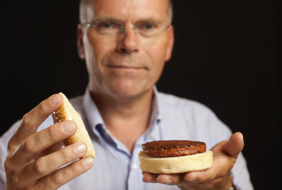 Professor Mark Post holding the first lab-grown burger