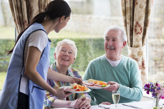 Elderly people dining in a carehome